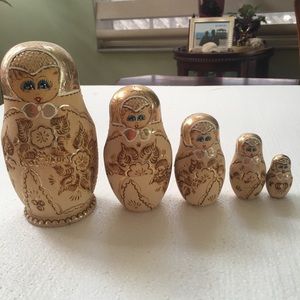 Five piece nesting doll set marked five M